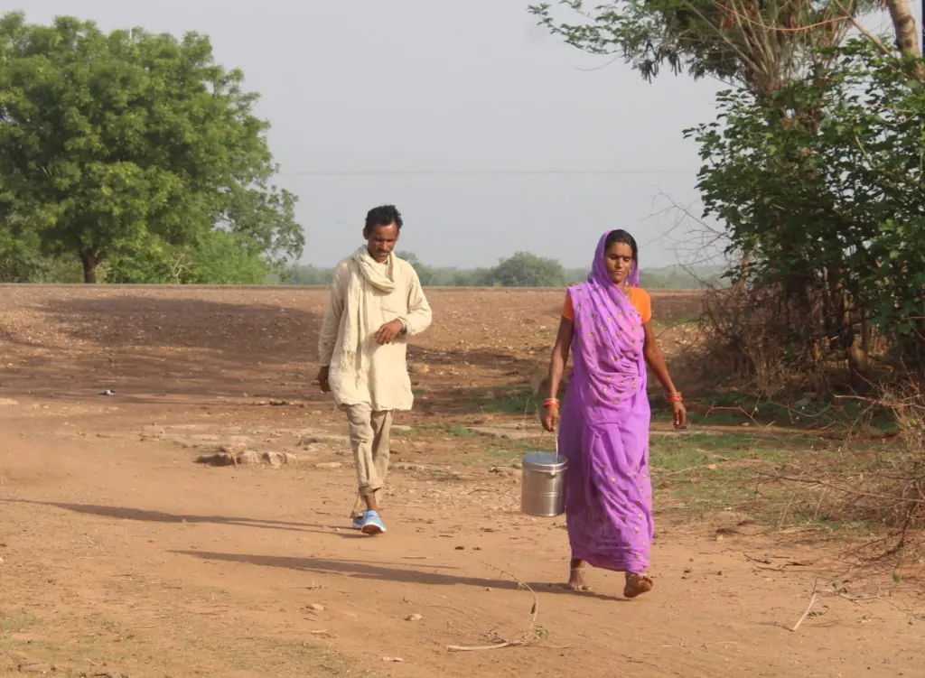 Kamlawati goes to deliver milk with her husband in Bundelkhand